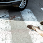 Scene Of A Road Accident With Car, Broken Parts And Injured Man Scene Of A Road Accident With Car, Broken Parts And Injured Man