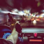 Man drink beer while driving Man drink beer while driving