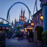 Disneyland california adventure theme park castle roller coaster at twilight evening Disneyland california adventure theme park castle roller coaster at twilight evening