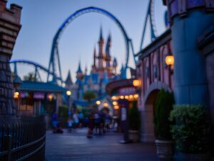 Disneyland california adventure theme park castle roller coaster at twilight evening