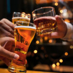 food and drink male friends are happy drinking beer and clinking food and drink male friends are happy drinking beer and clinking