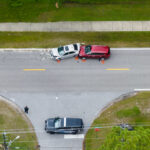 First responders personnel and vehicles responding to car accident site on American street in Florida. Emergency services helping victims of vehicle crash on road in USA First responders personnel and vehicles responding to car accident site on American street in Florida. Emergency services helping victims of vehicle crash on road in USA