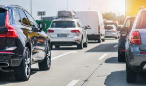 Car rush hours city street. Cars on highway in traffic jam